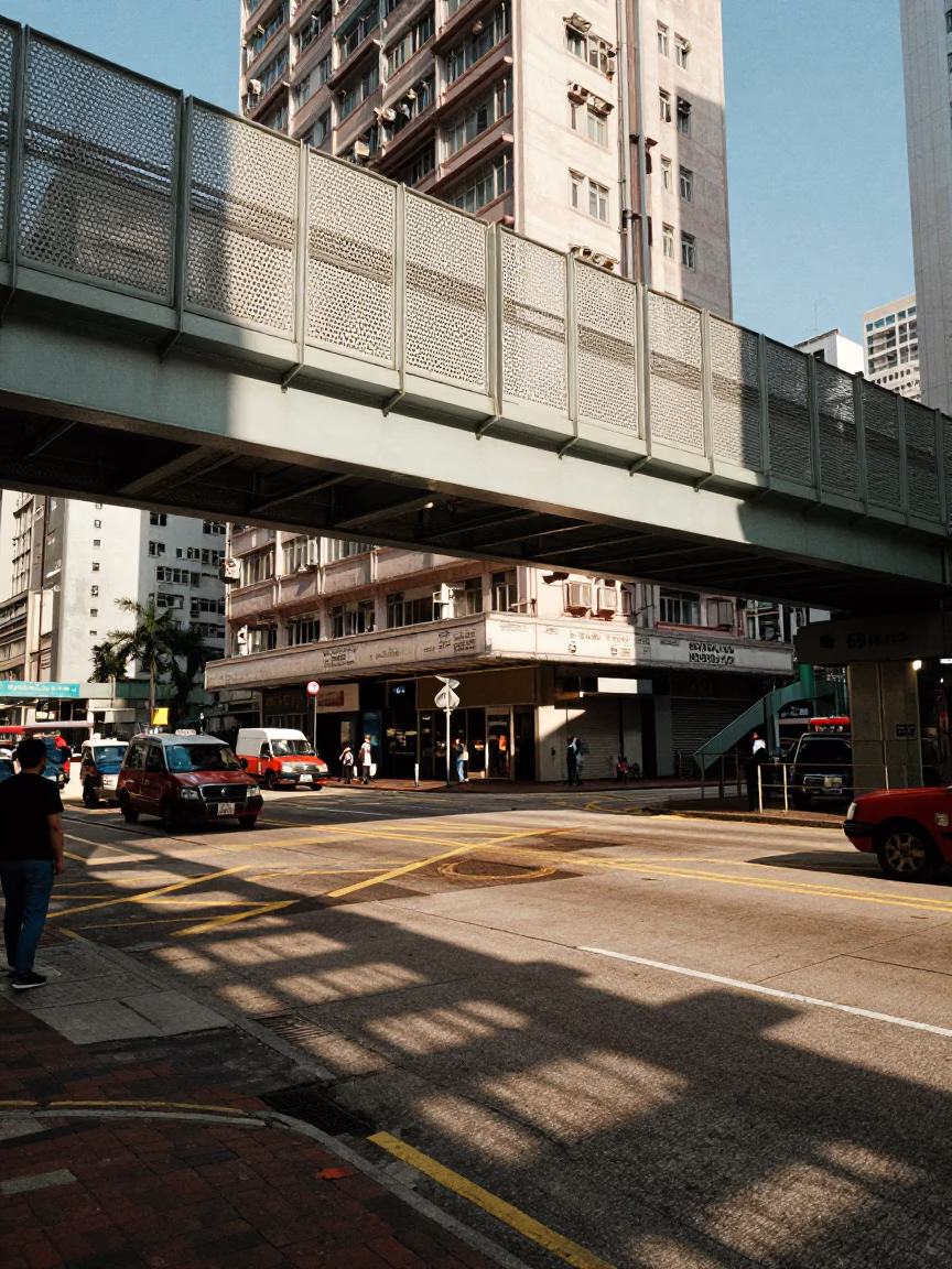 Hong Kong Late Afternoon Street Scene with Perforated Metal Overpass and Wet Footsteps in in Hong Kong, Hong Kong