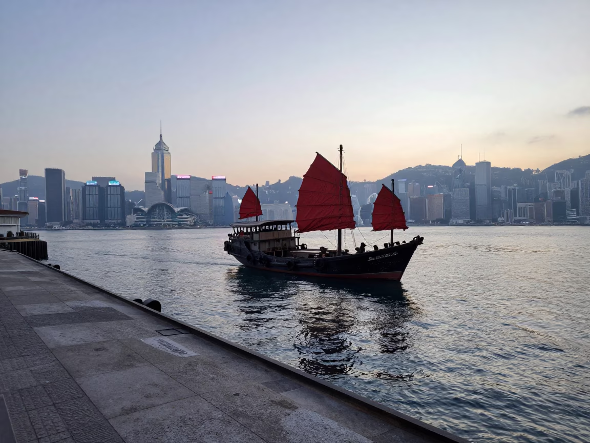 Hong Kong Morning Harbor Junk Boat at Dawn with Concrete Pier and City Skyline in in Hong Kong, Hong Kong