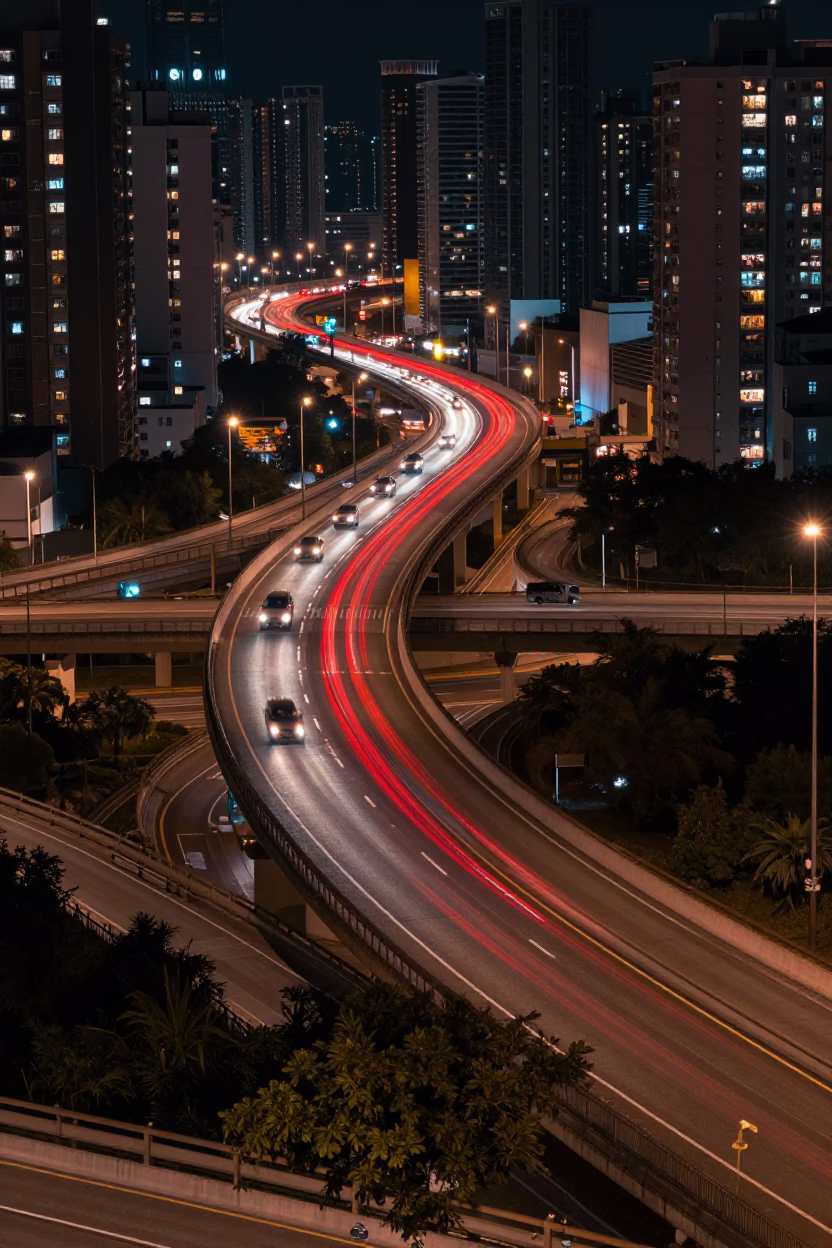 Hong Kong Night Traffic Streaks Over Highway Interchange Bridge at Deep Night in in Hong Kong, Hong Kong
