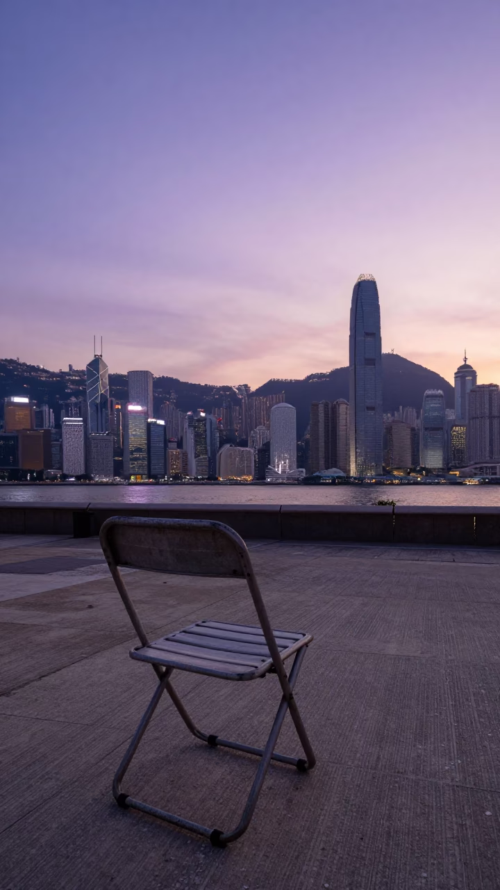 Hong Kong Sunset Skyline View from Public Park with Folding Chair and Glass Drain in in Hong Kong, Hong Kong