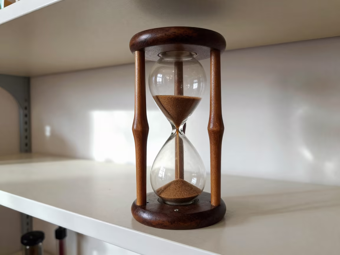 Hourglass Sand Flowing on Workshop Shelf in on a workshop shelf in Frankfurt