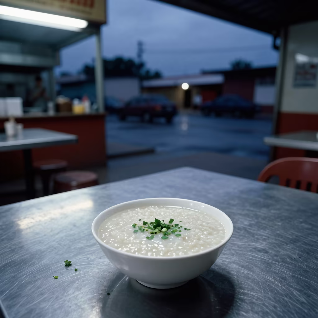 Humble Congee Bowl on Steel Diner Table in at a roadside diner table in Campeche