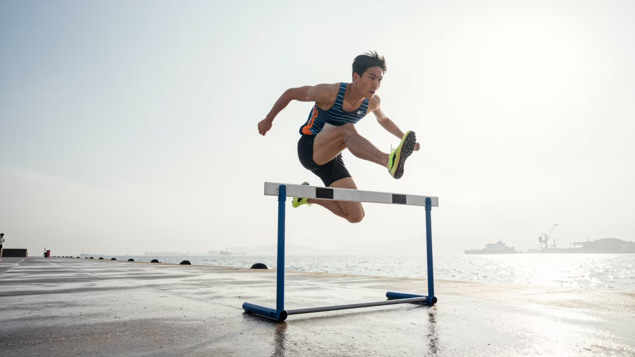 Hurdler Clearing Barrier on Chiba Harbor Quay in at a harbor quay near Chiba
