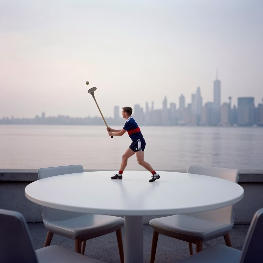 Hurling Player Striking Ball on Cafe Table in on a cafe table by a window in New York