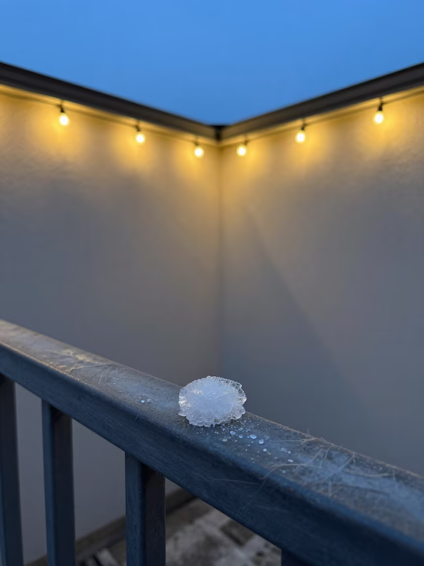 Ice Crystal on Steel Railing Blue Hour in against woven linen fibers in Stockholm