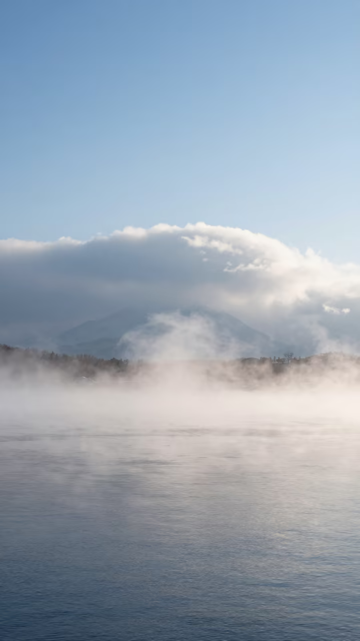 Ice Fog Over Sapporo Thunderheads in over a horizon of stacked thunderheads near Sapporo