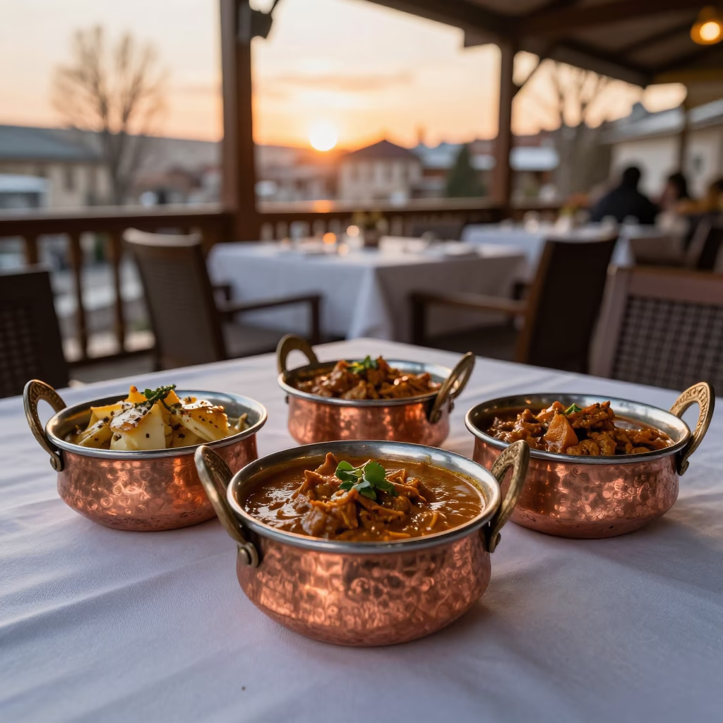 Indian Curry in Copper Bowls on Linen in on a linen-covered restaurant table in Yüksekova district