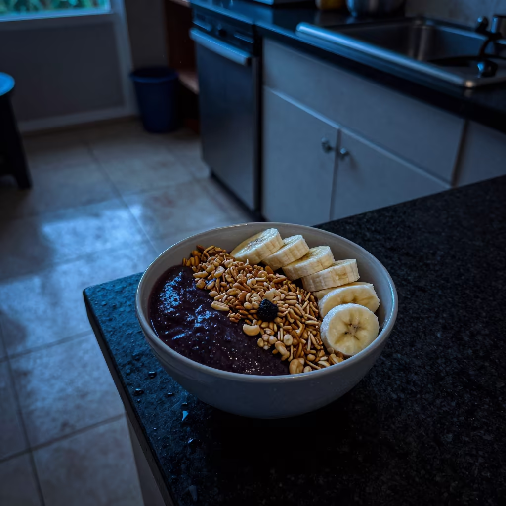 Indigo Twilight Acai Bowl with Granola and Banana in Jimma in on a kitchen worktop in Jimma