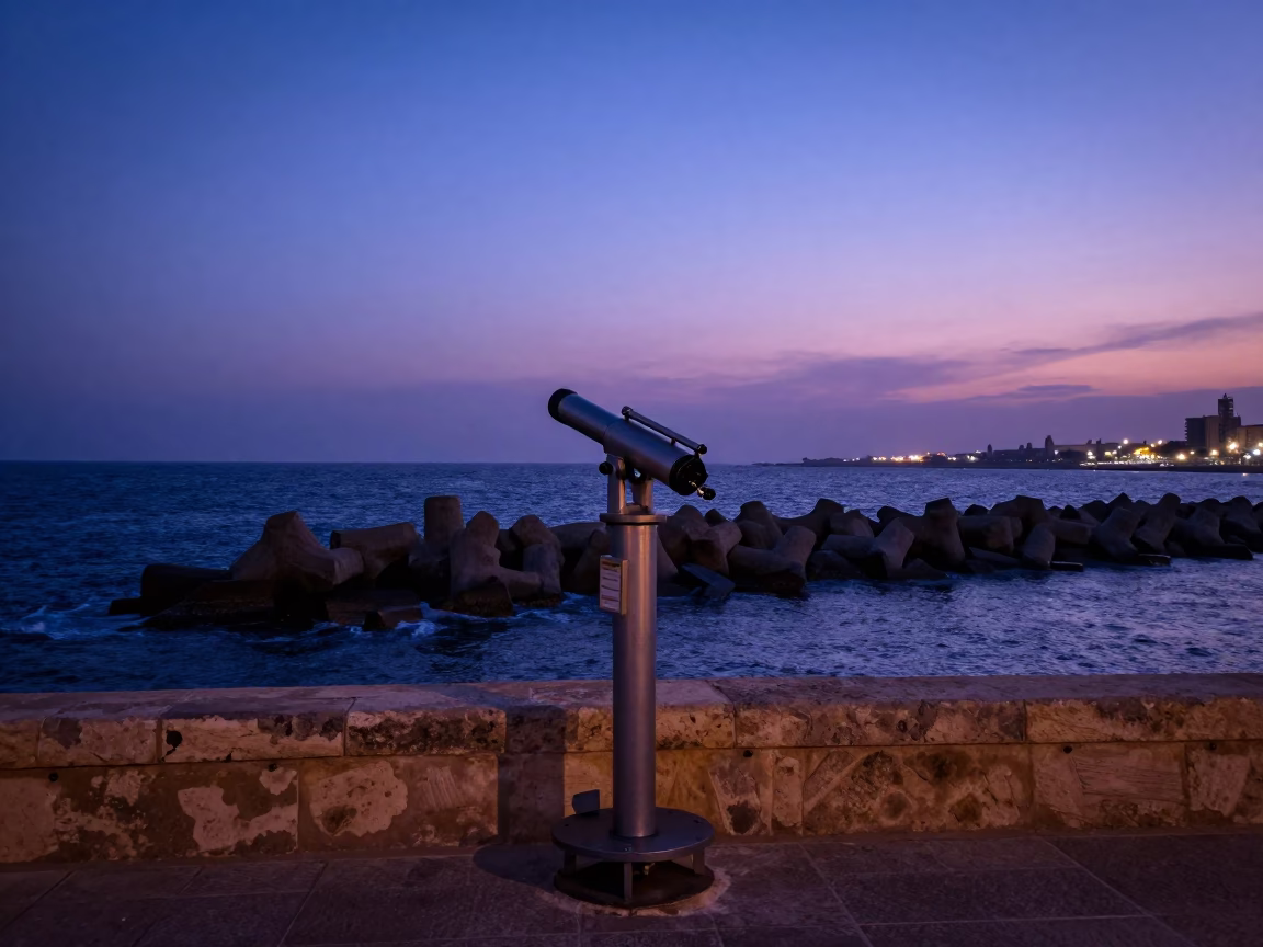 Indigo Twilight Alexandria Egypt Street Scene with Astronomer Telescope and Breakwater Tetrapods in in Alexandria, Egypt