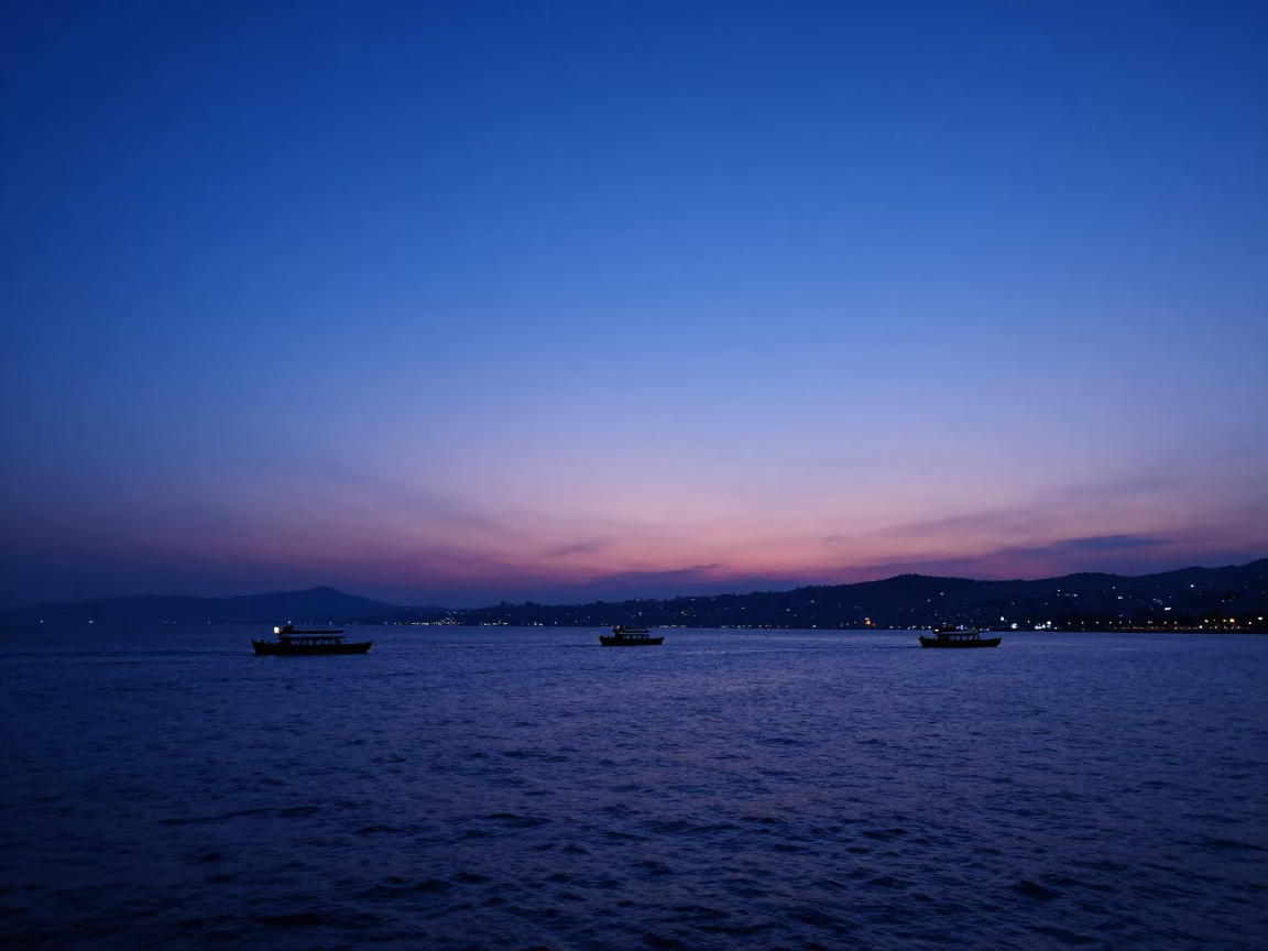 Indigo Twilight Horizon Over Izmir Bay with Coastal Traffic and City Lights in in Izmir, Turkey