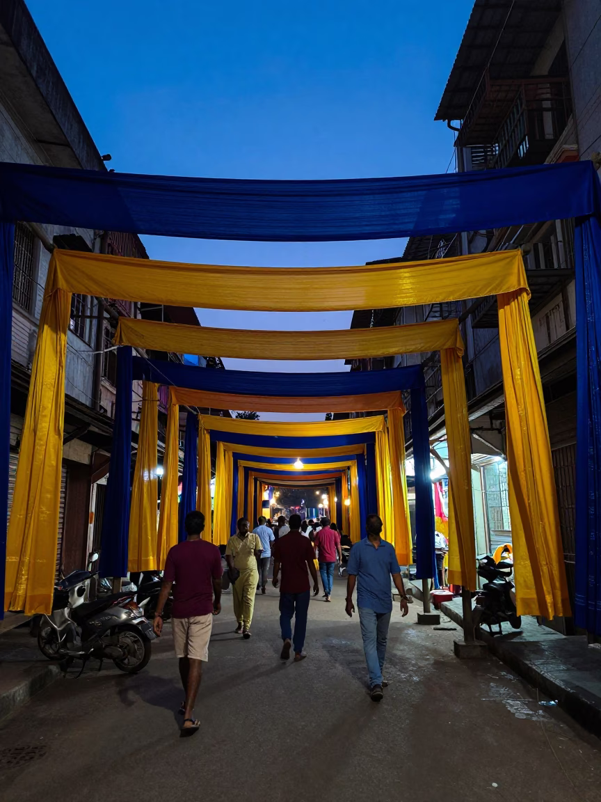 Indigo Twilight Kolkata Street Scene with Hanging Silk Fabrics and Urban Activity in in Kolkata, India