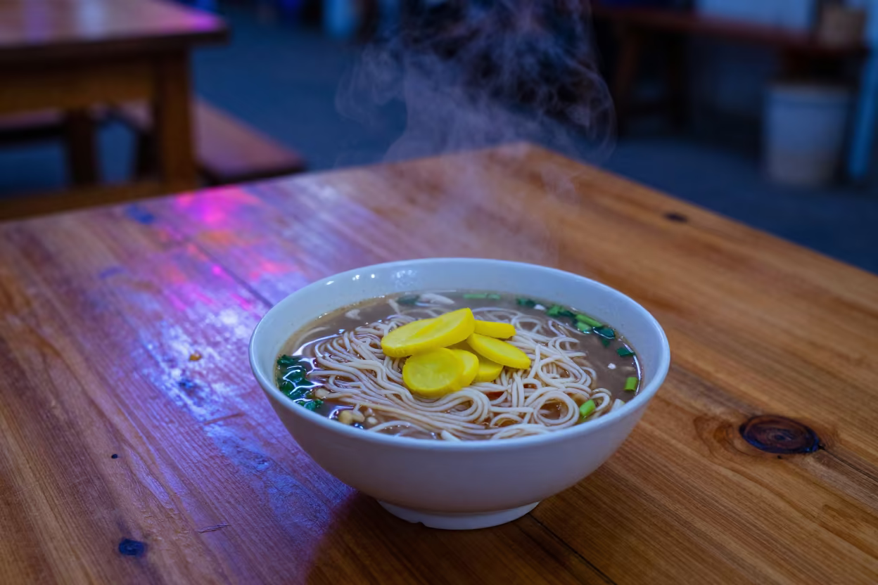 Indigo Twilight Shan Noodles with Pickled Mustard in on a rustic wooden table in Russeifa