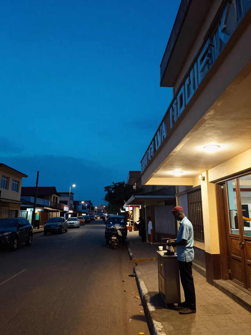 Indigo Twilight Street Scene in Accra Ghana with Hotel Awning and Valet Stand in in Accra, Ghana