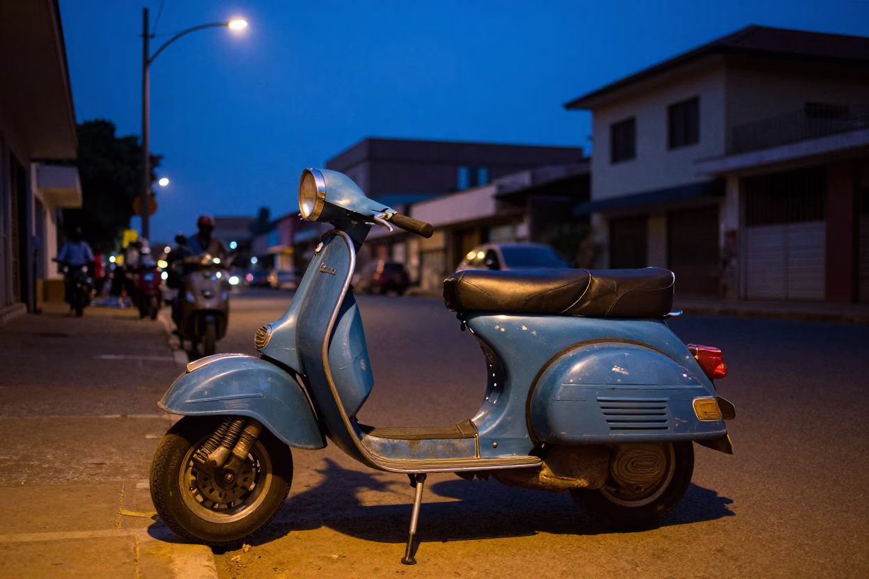 Indigo Twilight Street Scene in Accra Ghana with Vintage Vespa and Local Market Activity in in Accra, Ghana