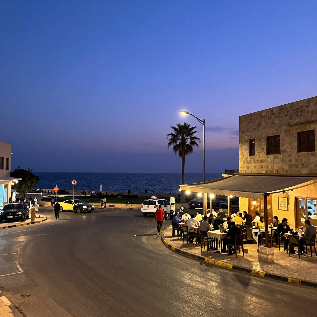 Indigo Twilight Street Scene in Alexandria Egypt with Local Café and Traffic in in Alexandria, Egypt