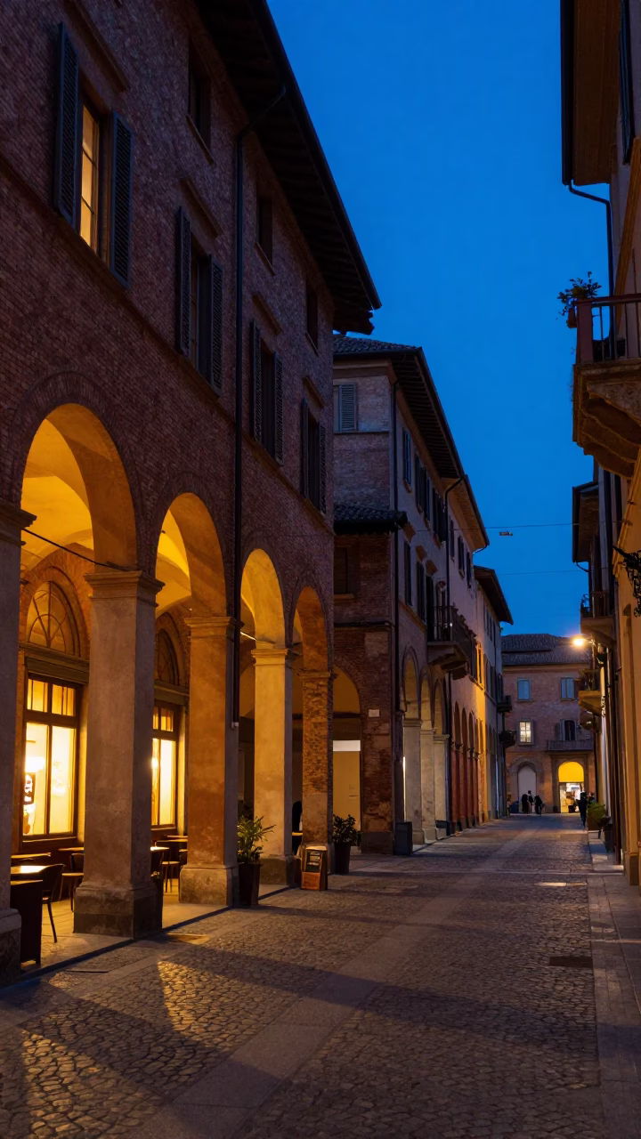Indigo Twilight Street Scene in Bologna Italy with Brick Architecture and Evening Pedestrians in in Bologna, Italy