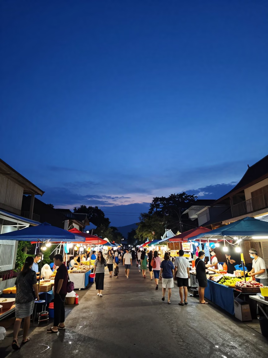 Indigo Twilight Street Scene in Chiang Mai Thailand with Local Market Activity in in Chiang Mai, Thailand