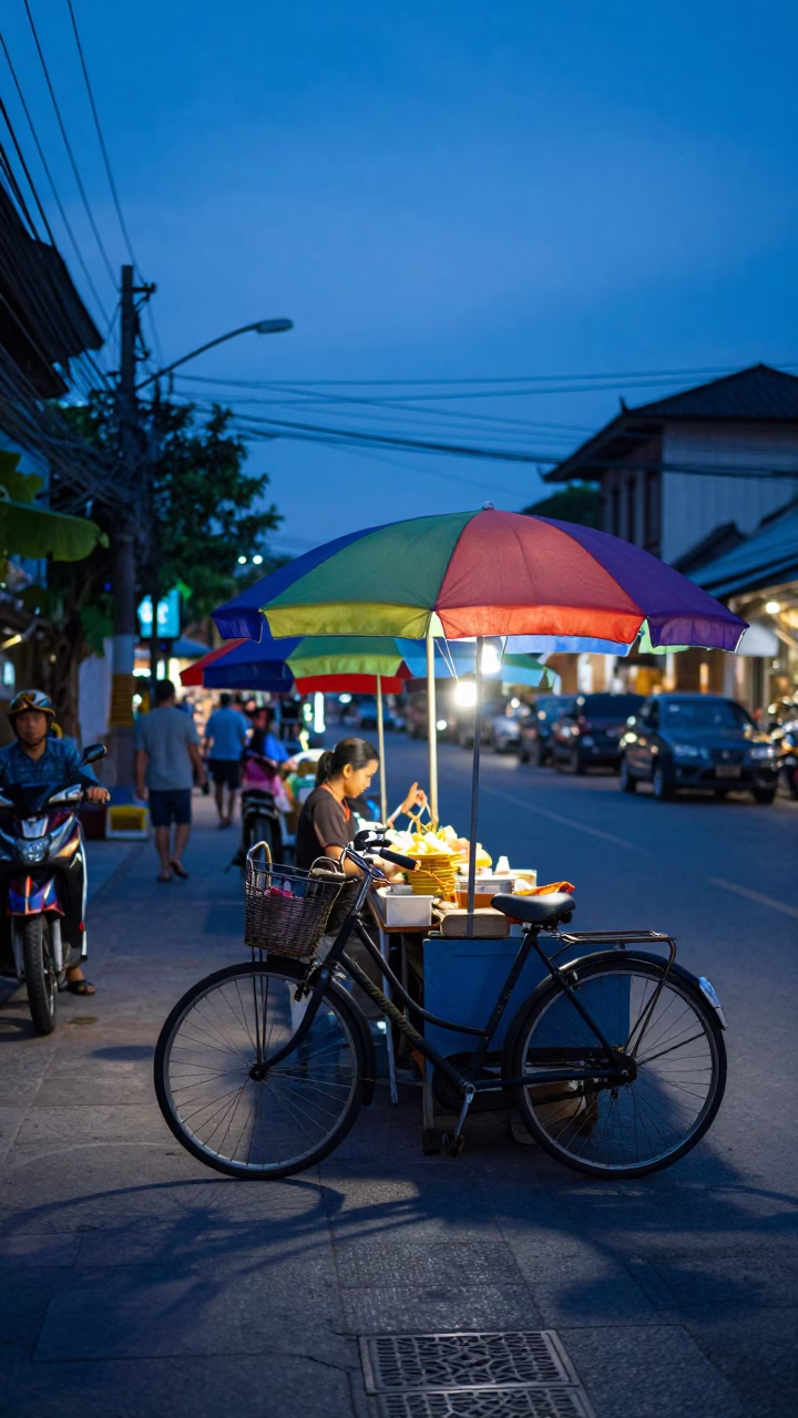 Indigo Twilight Street Scene in Chiang Mai Thailand with Vintage Bicycle and Colorful Umbrellas in in Chiang Mai, Thailand