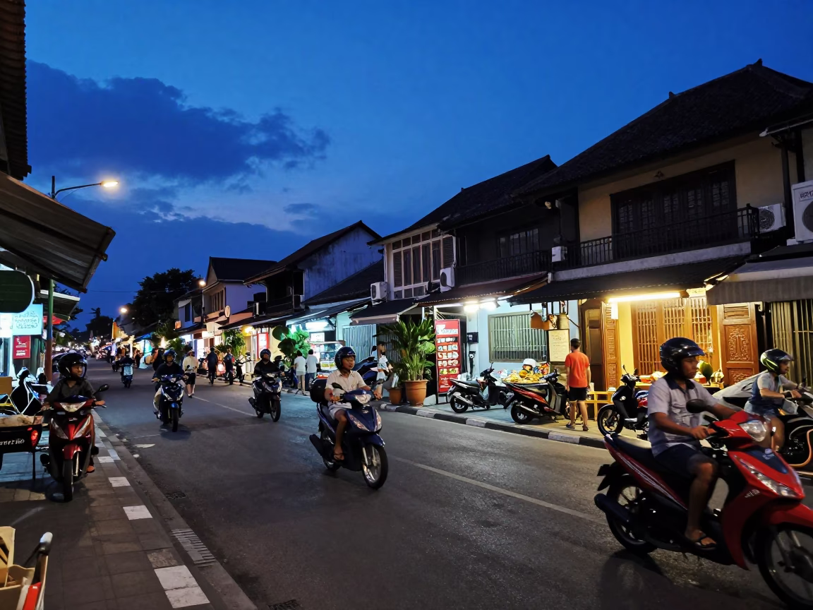 Indigo Twilight Street Scene in Denpasar Bali with Motorbikes and Local Shopfronts in in Denpasar, Indonesia