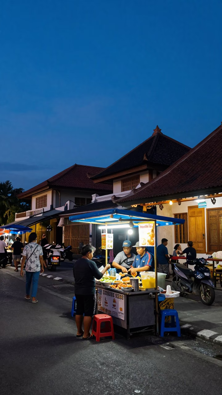Indigo Twilight Street Scene in Denpasar Indonesia with Local Food Stall and Bicycle in in Denpasar, Indonesia