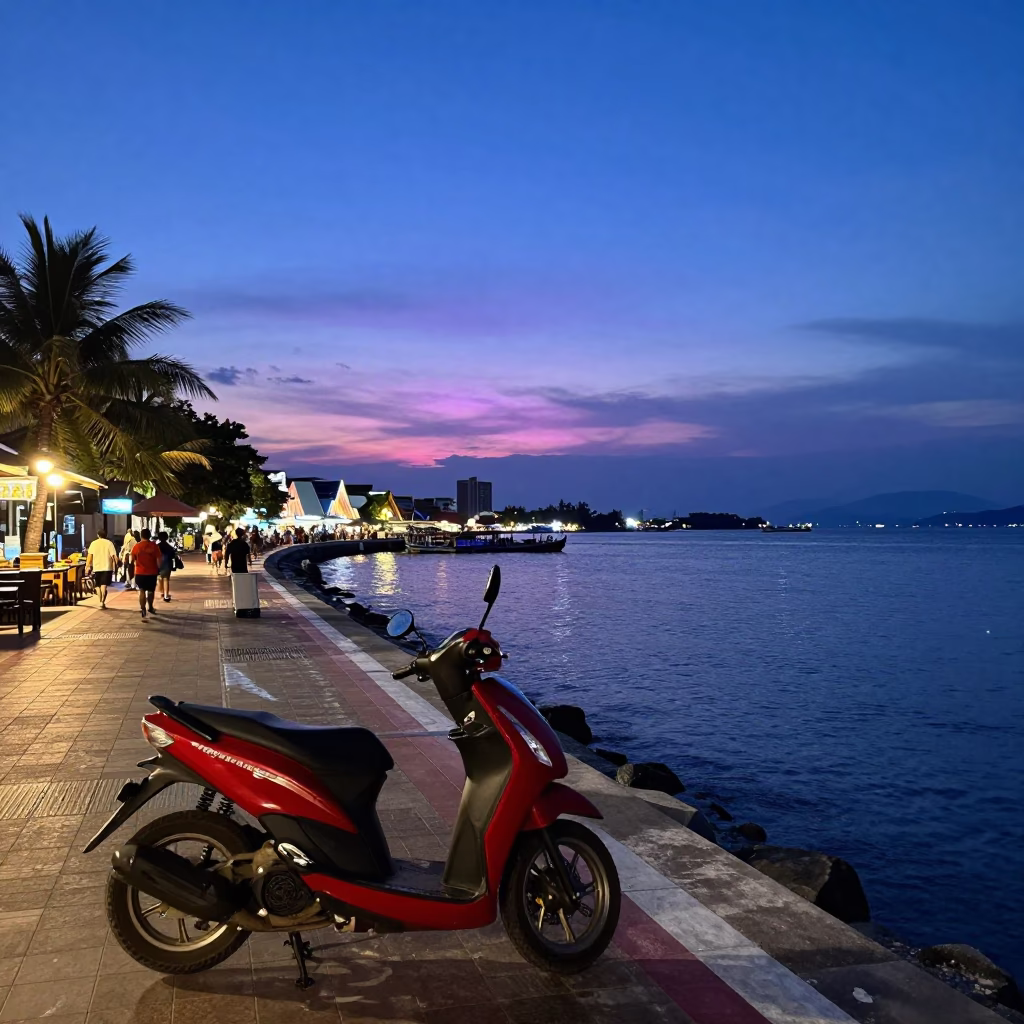 Indigo Twilight Street Scene in Phuket Thailand with Scooter and Harbor Promenade in in Phuket, Thailand