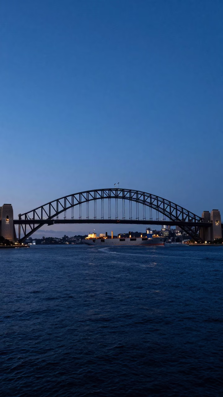 Indigo Twilight Sydney Harbour Bridge and Cargo Ship Horizon Realistic Photograph in in Sydney, New South Wales, Australia