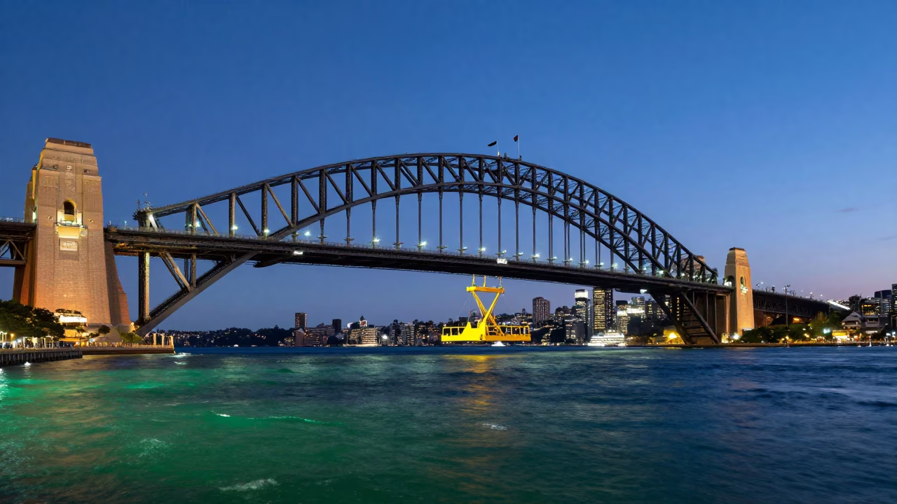 Indigo Twilight Sydney Harbour Bridge Maintenance Cradle Over Green Water in in Sydney, New South Wales, Australia