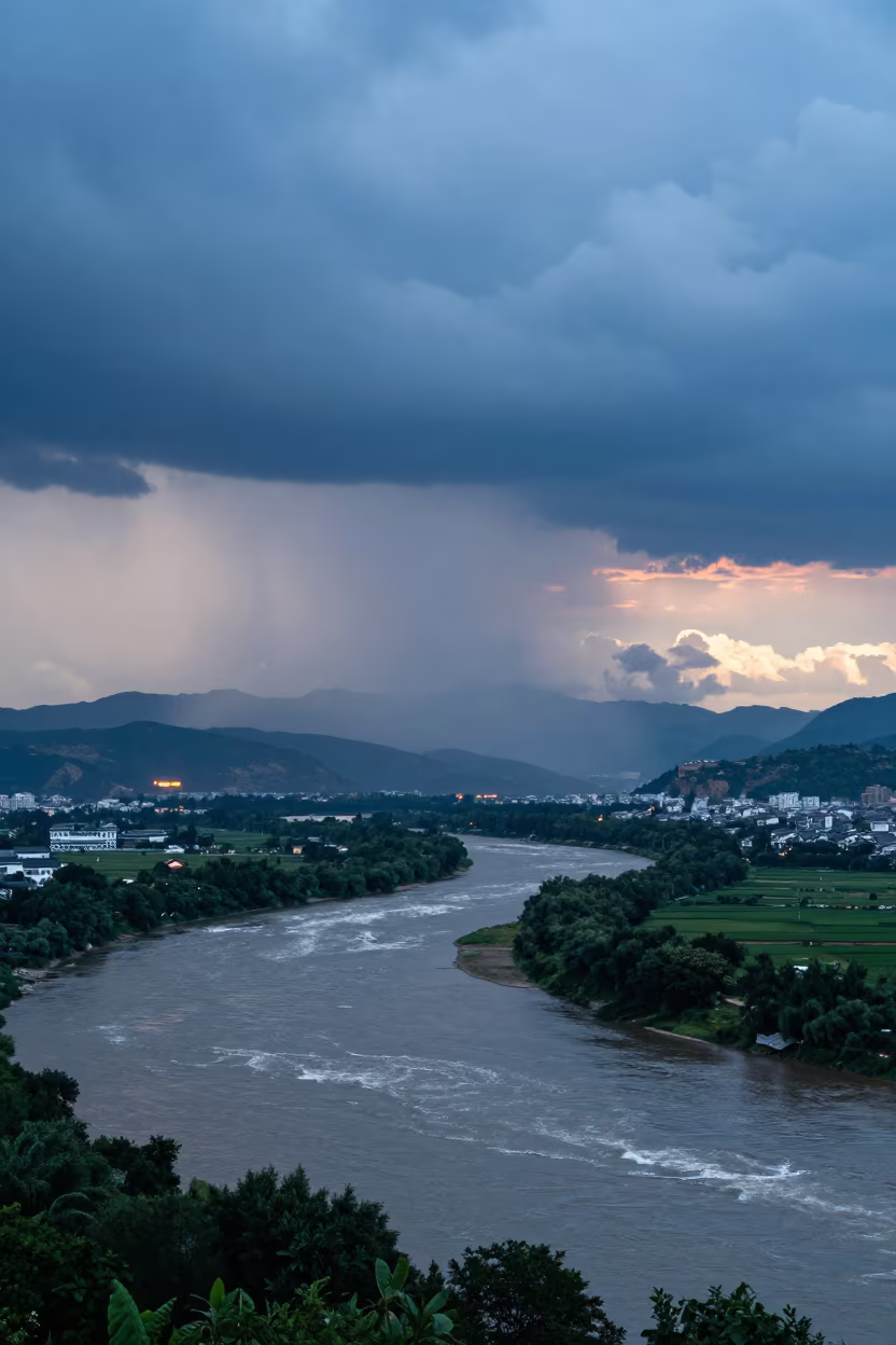 Indigo Twilight Thunderhead Over Yunnan River Valley in across a storm-bright plain in Yunnan