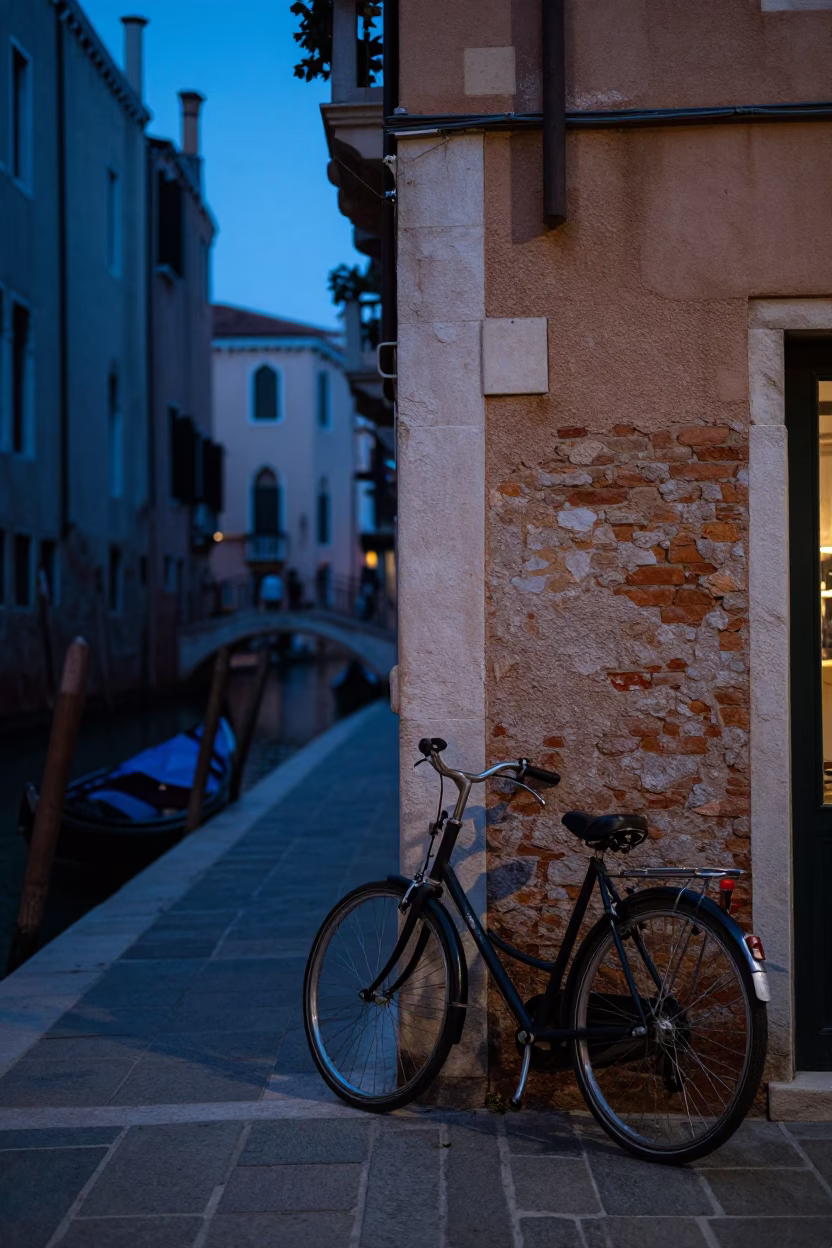 Indigo Twilight Venice Canal Street Scene with Bicycle and Glass Vase Reflections in in Venice, Italy