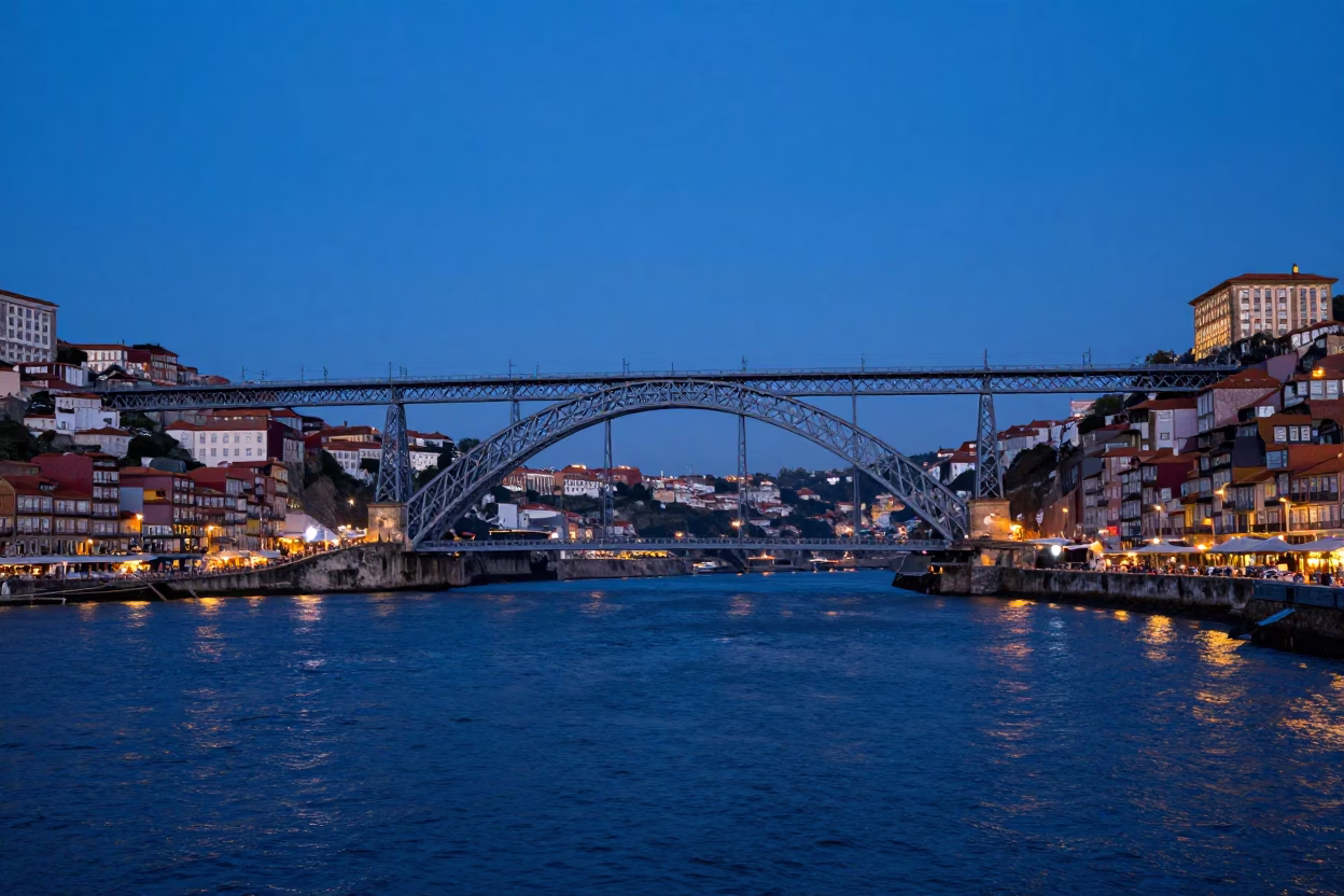 Indigo Twilight View of Porto Portugal Douro River Bridge and Raincoats in in Porto, Portugal