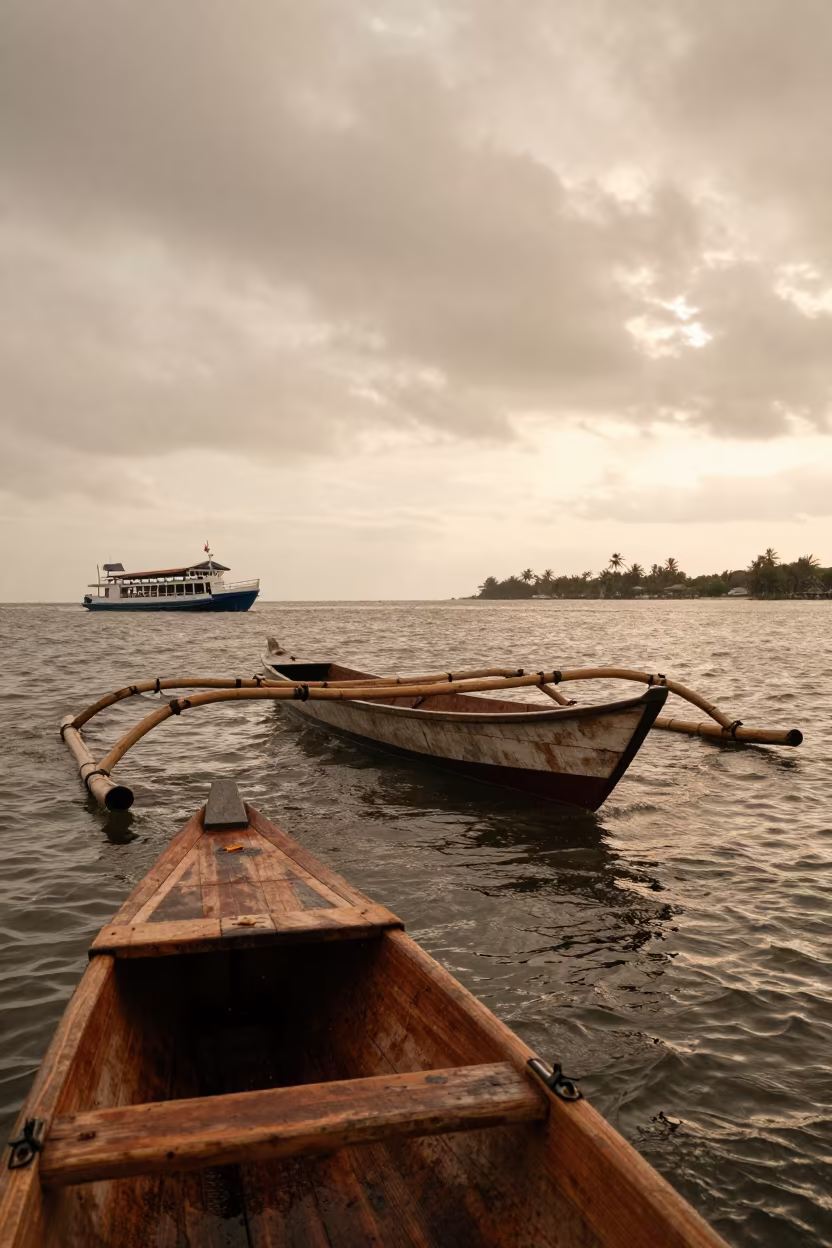 Indonesian Fishing Boat Ferry Crossing Sunset in across a remote ferry crossing near Yogyakarta