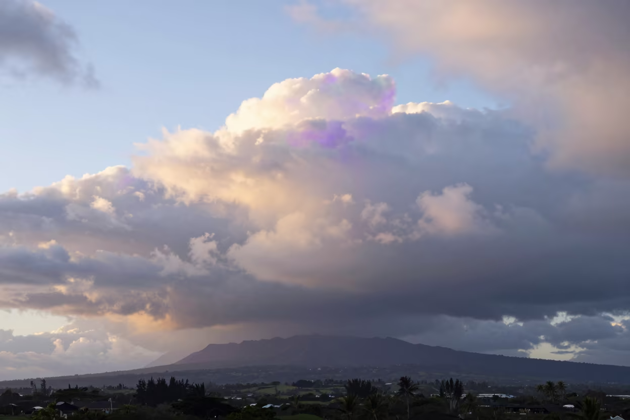 Iridescent Cloud Fragment Over Hawaii Plain in across a storm-bright plain in Hawaii
