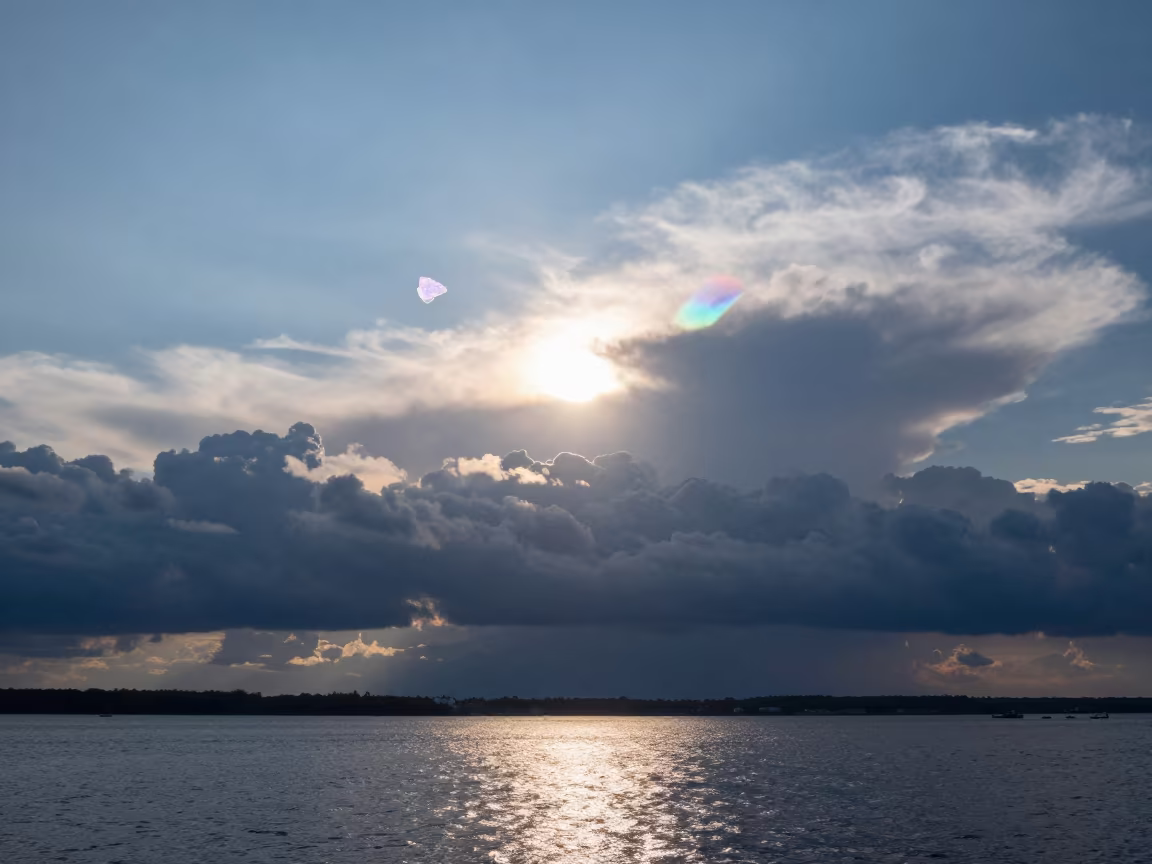 Iridescent Cloud Fragment Over Lviv Thunderheads in over a horizon of stacked thunderheads near Lviv