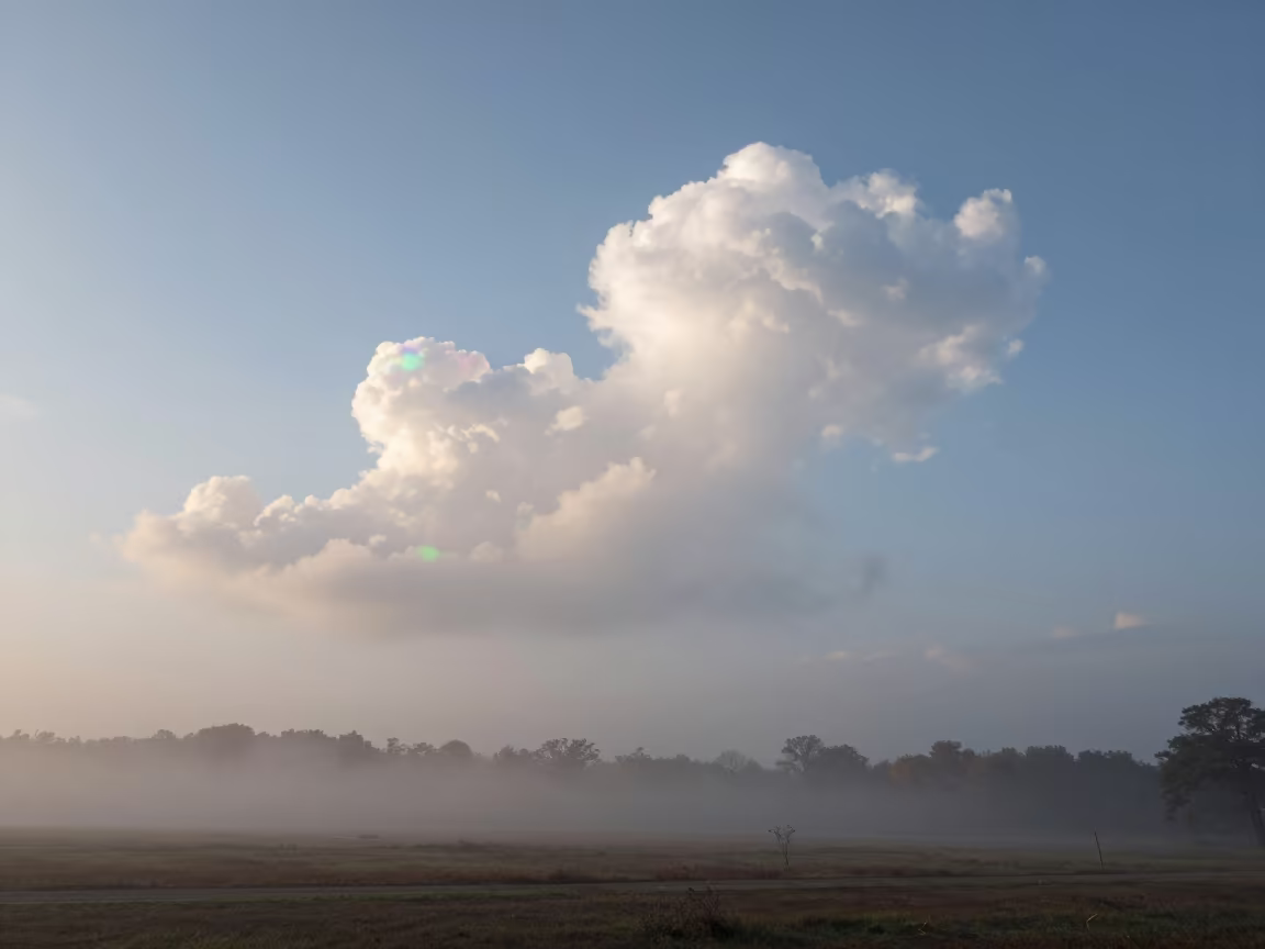 Iridescent Cloud Shimmering Near Cumulus Tower in through low marine fog near New Orleans