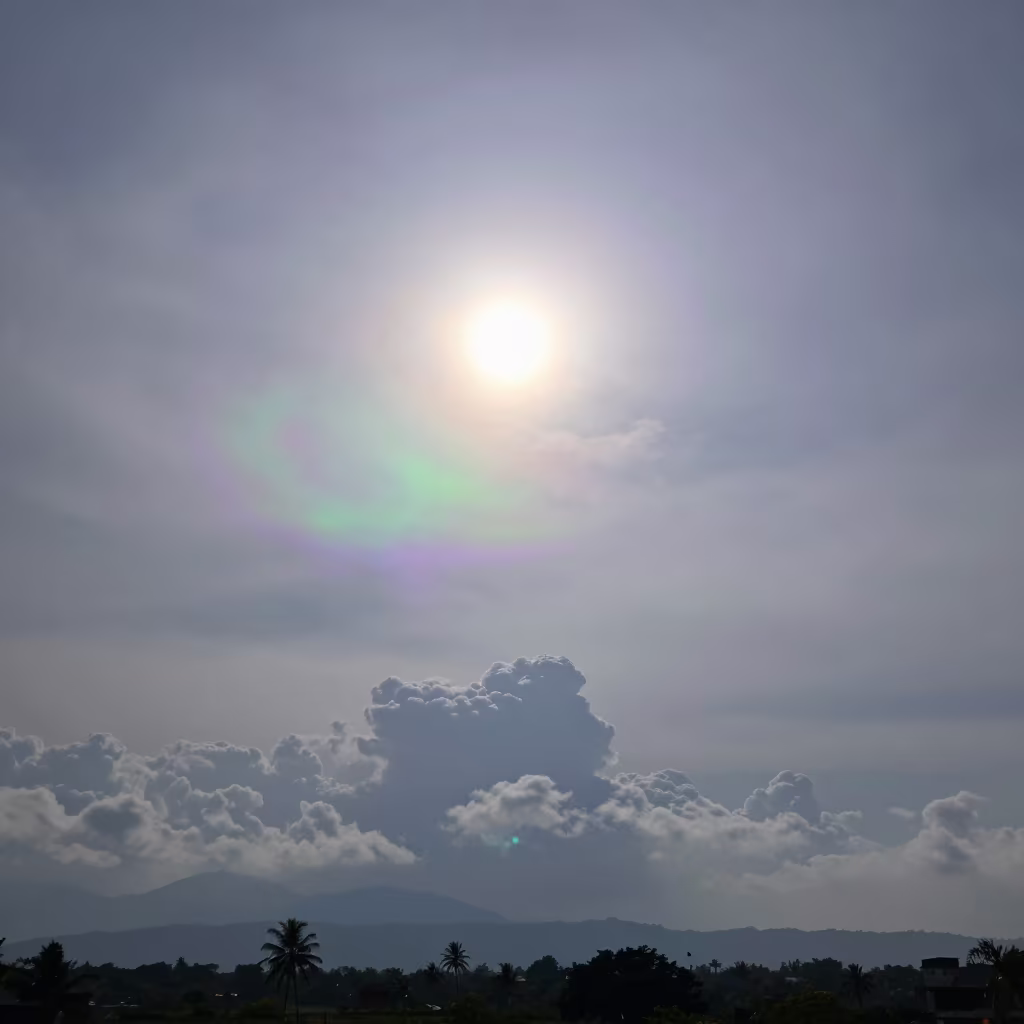 Iridescent Cloud Beside Sun Over Tamil Nadu Storms in over a horizon of stacked thunderheads in Tamil Nadu