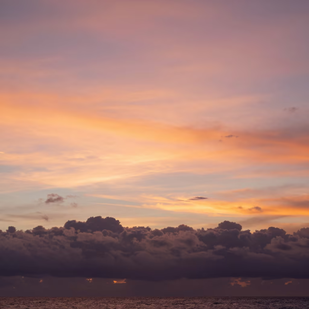 Iridescent Cloud Sunset Over Philippines Thunderheads in over a horizon of stacked thunderheads in Philippines