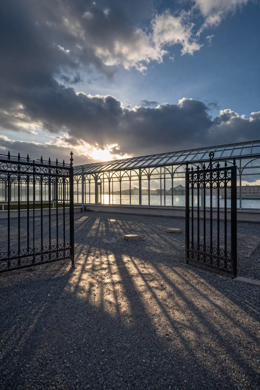 Iron Gate Shadows on Gravel Under Blue Hour Sky in inside a glass-roofed arcade near Margilan