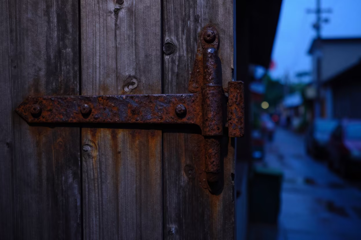 Iron Hinge on Weathered Wood in Ximending Twilight in in Ximending, Taipei