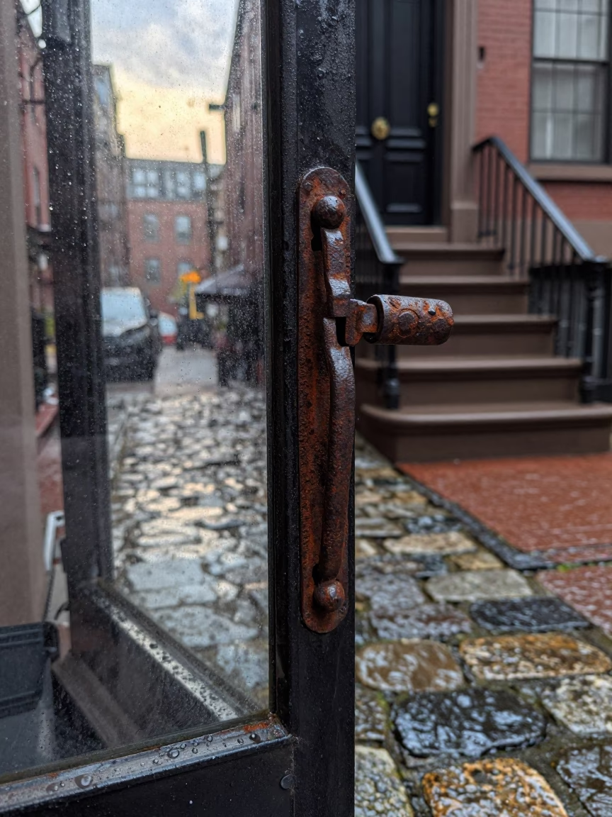 Iron Latch And Wet Cobblestone Stoop in Boston in in Boston, Massachusetts, United States
