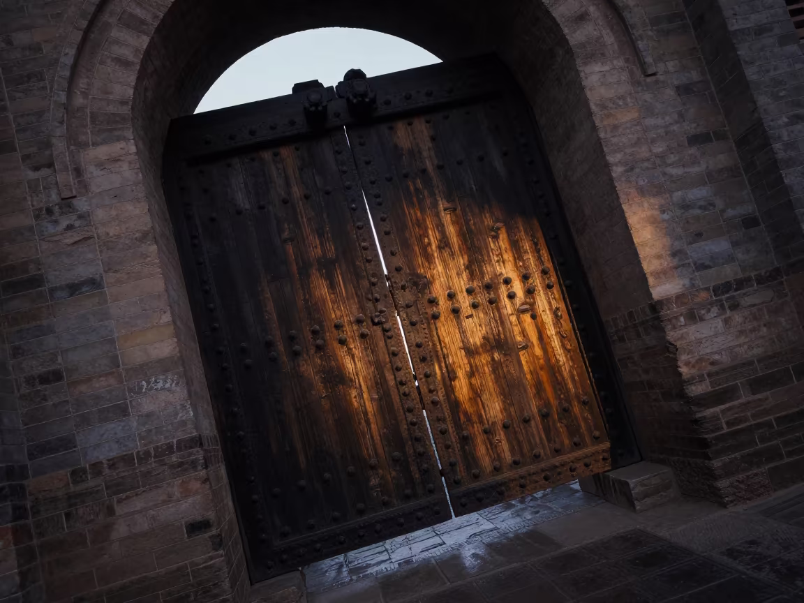 Iron-studded Oak Gate in Pingyao Evening Shadow in inside a skylit passageway in Pingyao