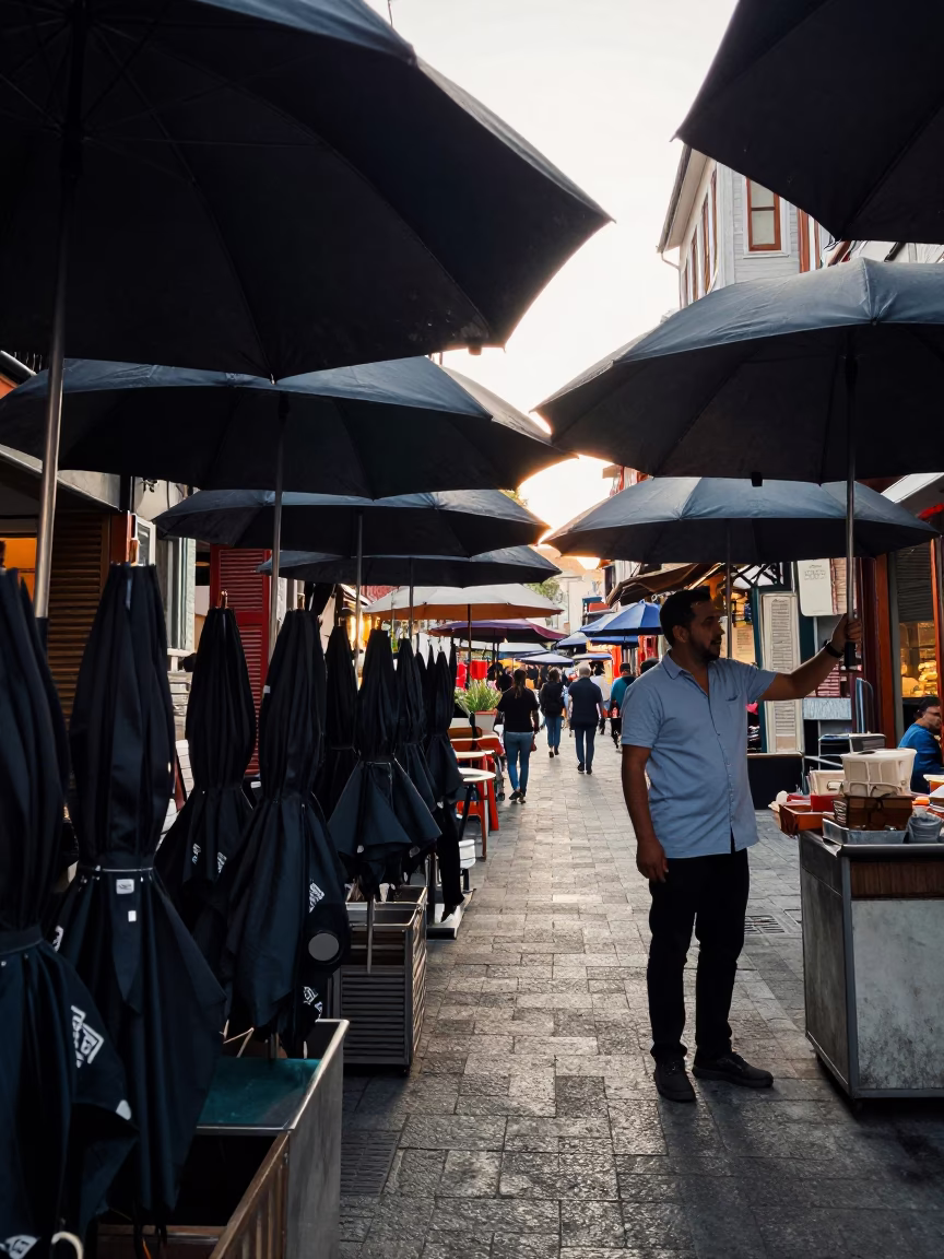 Istanbul Early Afternoon Street Scene with Umbrellas and Local Market Activity in in Istanbul, Turkey
