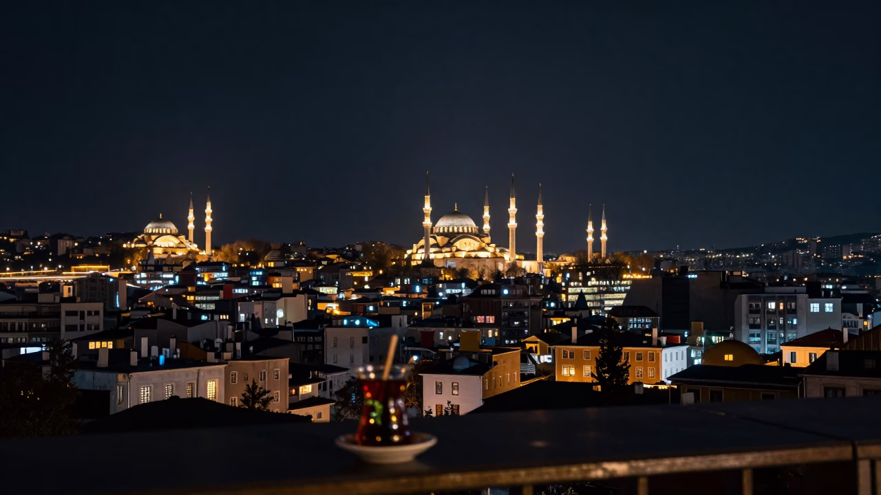 Istanbul Night Skyline View from Galata Terrace with Tea Glasses and Urban Lights in in Istanbul, Turkey