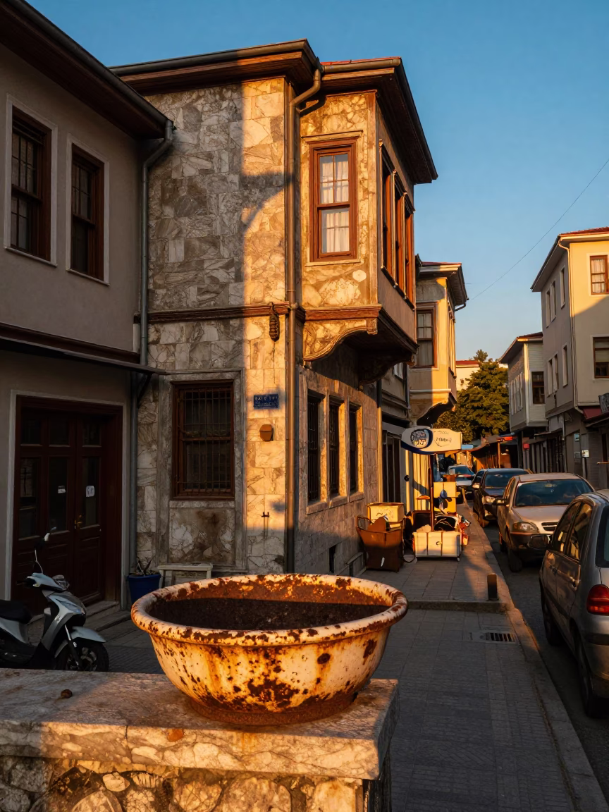 Istanbul street scene at sunset with rusted basin and fruit knife on balcony in in Istanbul, Turkey