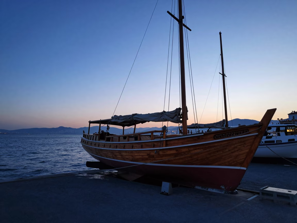 Izmir Turkey before sunrise with wooden sailboat in boatyard and cable car view in in Izmir, Turkey