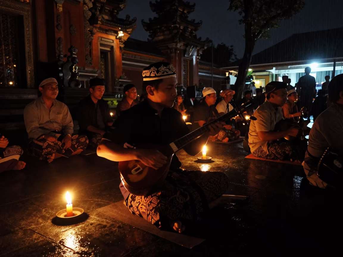 Silhouette of Javanese Rebab Player in Candlelight in in a temple precinct in Jakarta