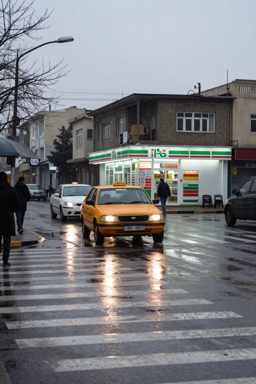 Kabul Crosswalk Sleet Taxi Storefront Afternoon in outside a fluorescent convenience store in Kabul