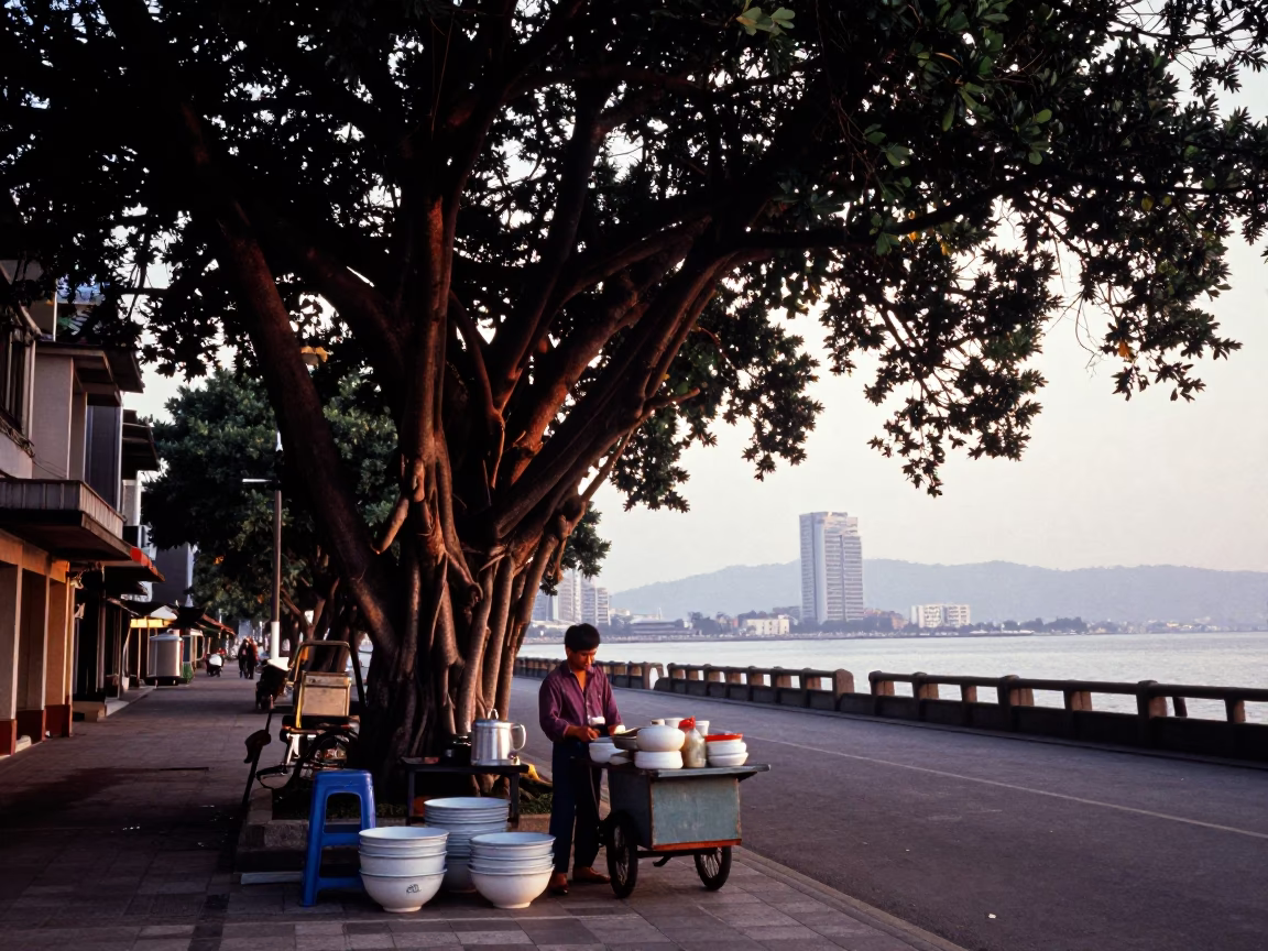 Kaohsiung Nautical Dawn Street Scene with Banyan Trees and Harbor Activity in in Kaohsiung, Taiwan