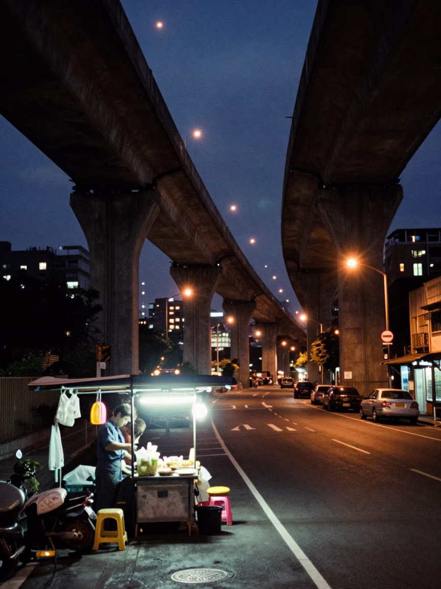 Kaohsiung Night Street Scene with Concrete Viaduct and Local Dining in in Kaohsiung, Taiwan