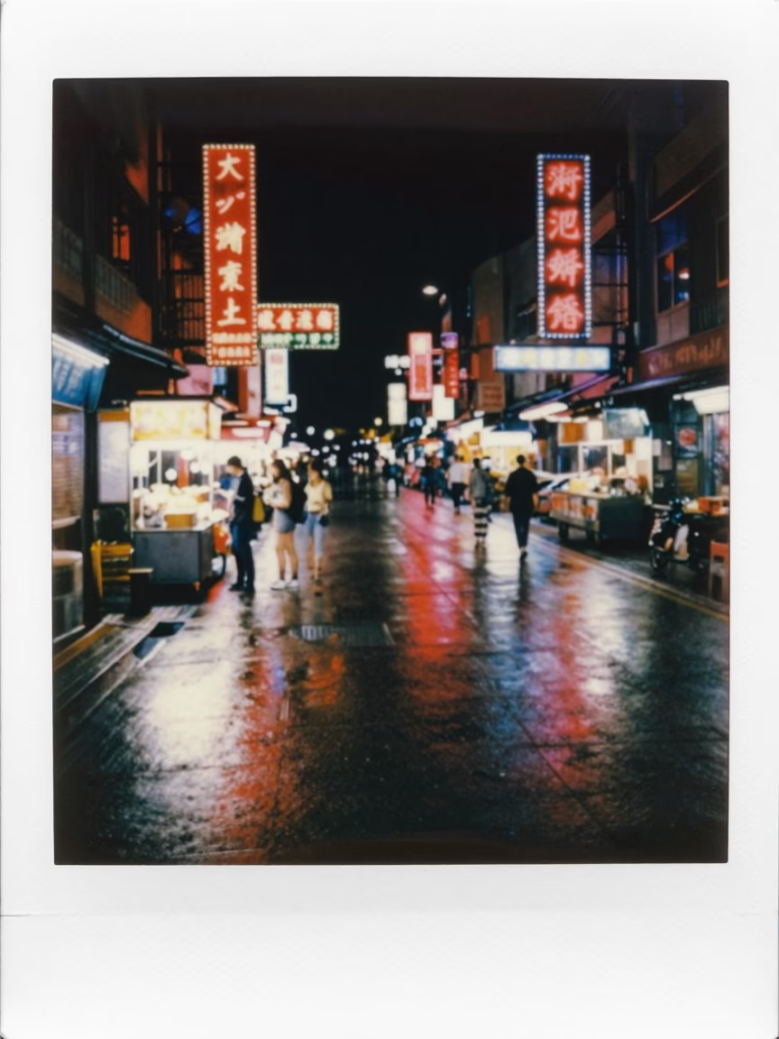 Kaohsiung Night Street Scene with Neon Reflections and Local Dining Culture in in Kaohsiung, Taiwan