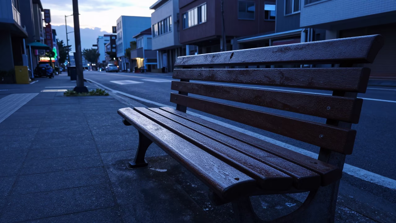 Kaohsiung Pre-Dawn Street Scene with Condensation on Bench and Urban Morning Activity in in Kaohsiung, Taiwan